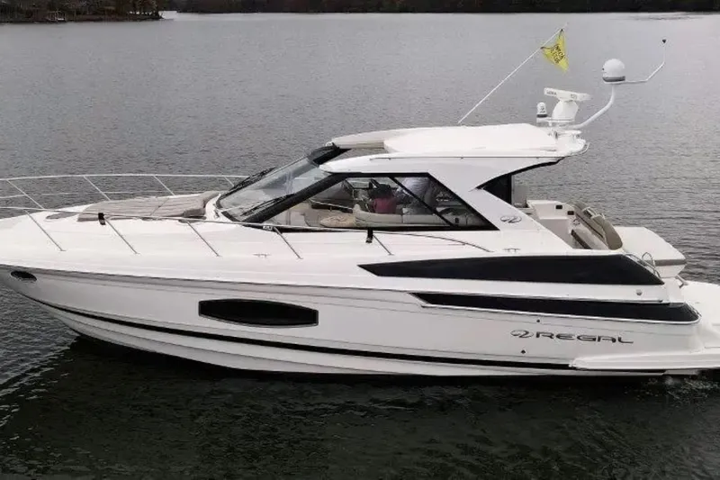 Yacht Photos Pics 2016 Regal 46 Sport Coupe yacht on calm water, side view.