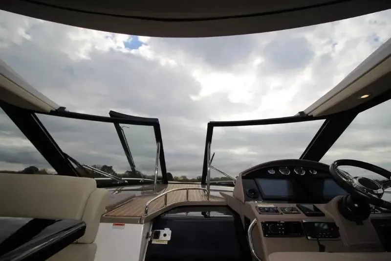  Yacht Photos Pics 2016 Regal 46 Sport Coupe yacht interior with open sunroof and modern dashboard controls.