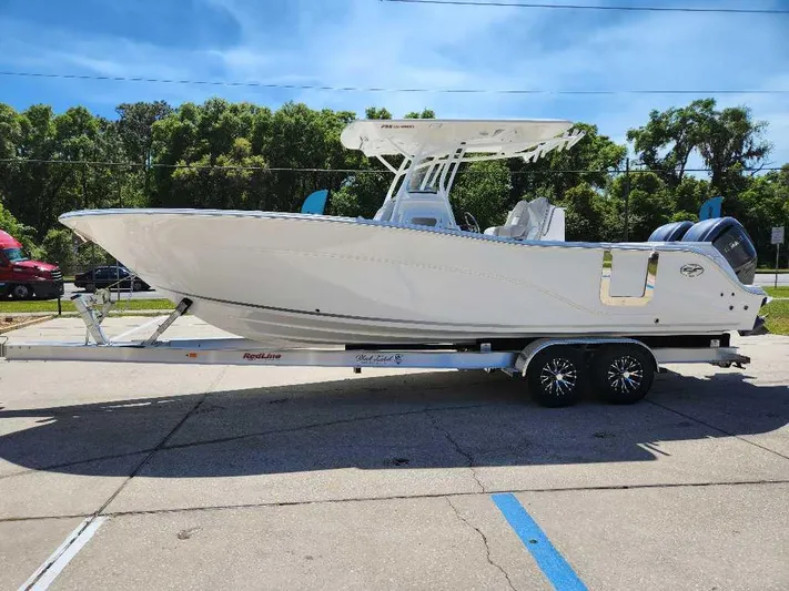 Black Label Marine Yacht Photos Pics 2023 Sea Fox 288 Commander boat on trailer, parked outdoors, sunny day.