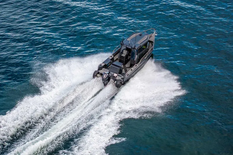  Yacht Photos Pics Aerial view of 2024 StabiX 240UCC boat speeding on open water.