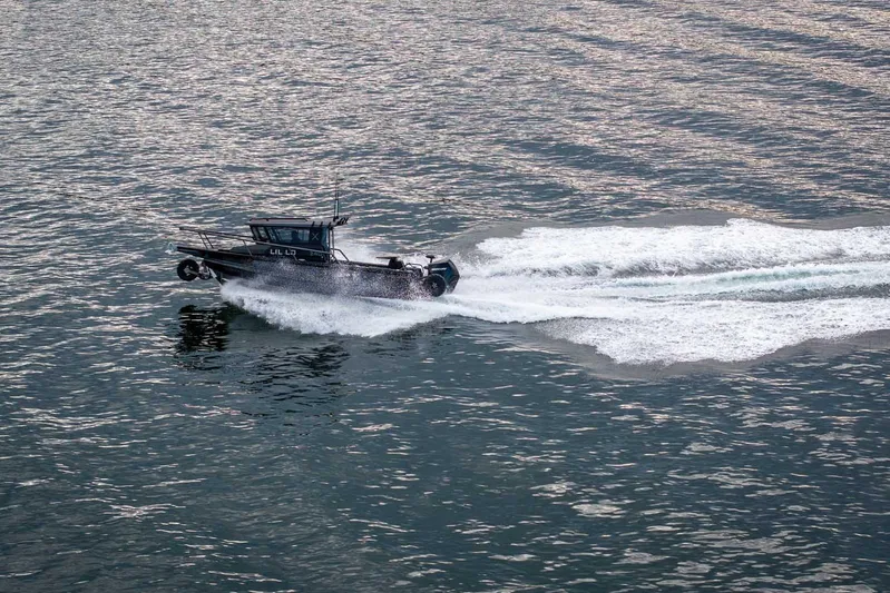  Yacht Photos Pics 2024 StabiX 240UCC boat cruising swiftly on open water.