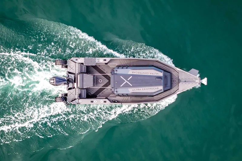  Yacht Photos Pics Aerial view of 2024 StabiX 240UCC boat cruising on open water.