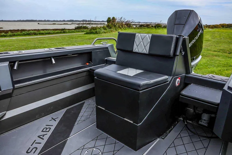  Yacht Photos Pics 2024 StabiX 240UCC boat interior with cushioned seating and modern design.
