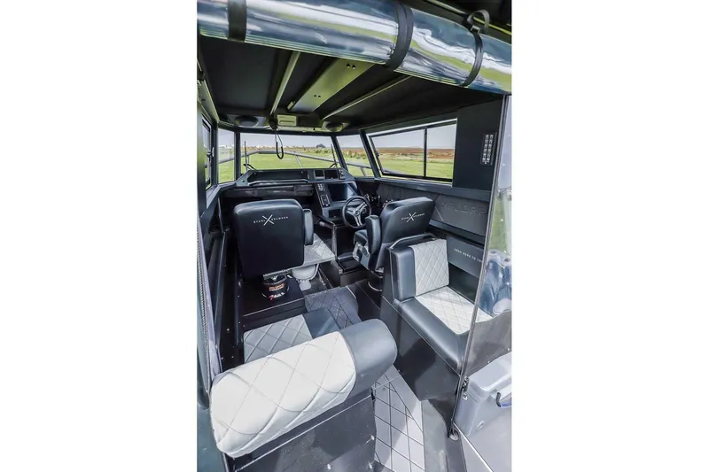  Yacht Photos Pics Interior of 2024 StabiX 240UCC boat with modern seating and dashboard.
