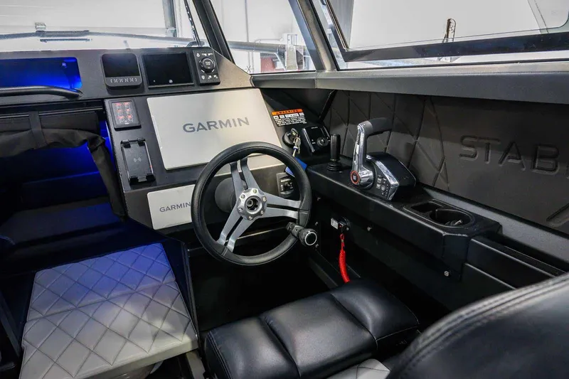  Yacht Photos Pics Interior of 2024 StabiX 240UCC boat with Garmin navigation system and modern controls.
