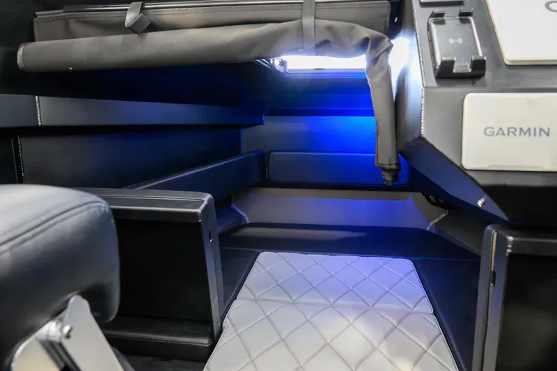  Yacht Photos Pics 2024 StabiX 240UCC interior with modern design, featuring Garmin technology and blue ambient lighting.