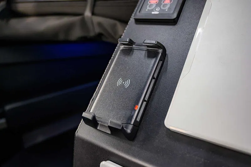  Yacht Photos Pics Wireless charging pad in a 2024 StabiX 240UCC vehicle interior.