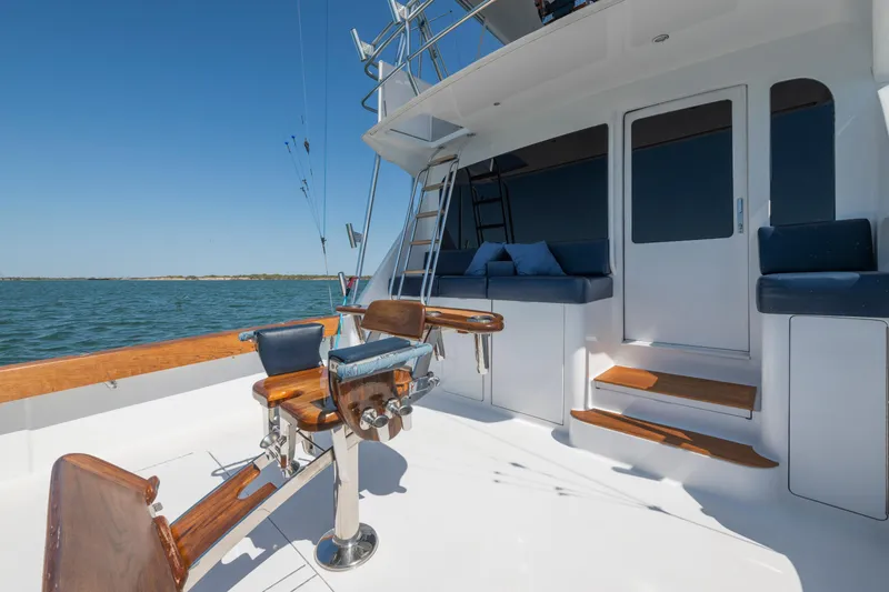 Walk West Yacht Photos Pics 2001 Viking Convertible yacht deck with fishing chairs and ocean view.