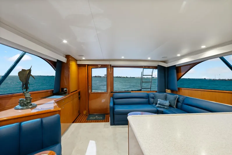 Walk West Yacht Photos Pics Luxurious interior of a 2001 Viking Convertible yacht with ocean view and elegant seating.