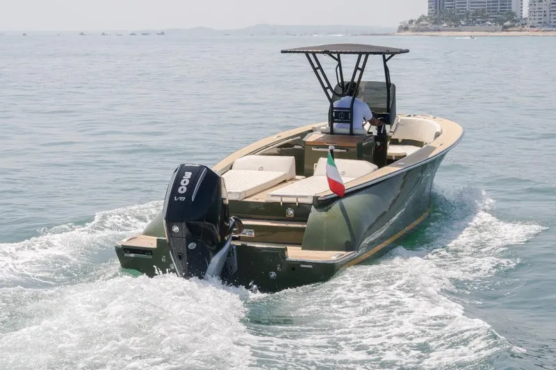  Yacht Photos Pics 2026 Lilybaeum Levanzo 25 Lounge Deck boat cruising on open water with Italian flag.