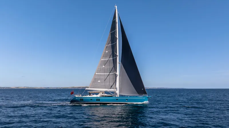 Karibu Yacht Photos Pics Sailing yacht Oyster 885 from 2013 cruising on open sea under clear blue sky.