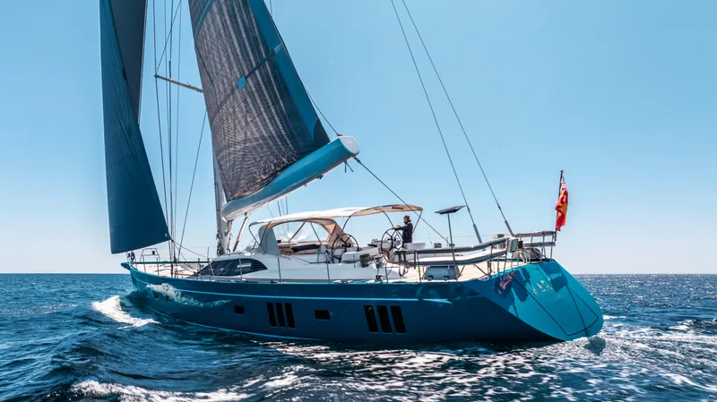 Karibu Yacht Photos Pics Sailing yacht Oyster 885, 2013 model, cruising on open sea under clear blue sky.