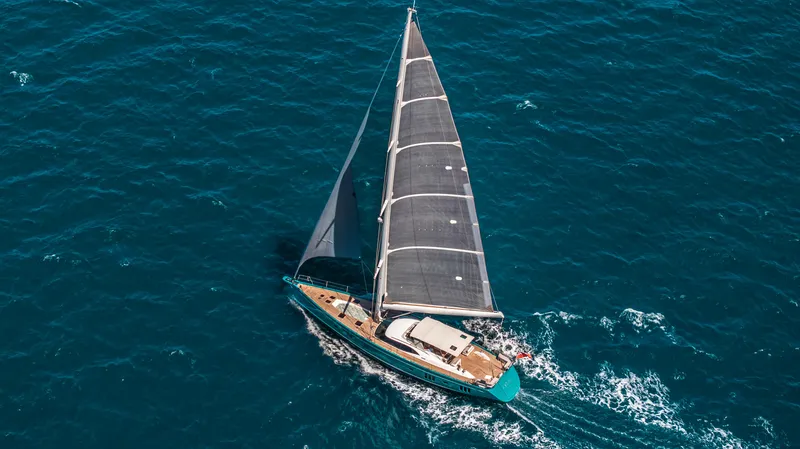 Karibu Yacht Photos Pics Aerial view of 2013 Oyster 885 yacht sailing on open blue sea.