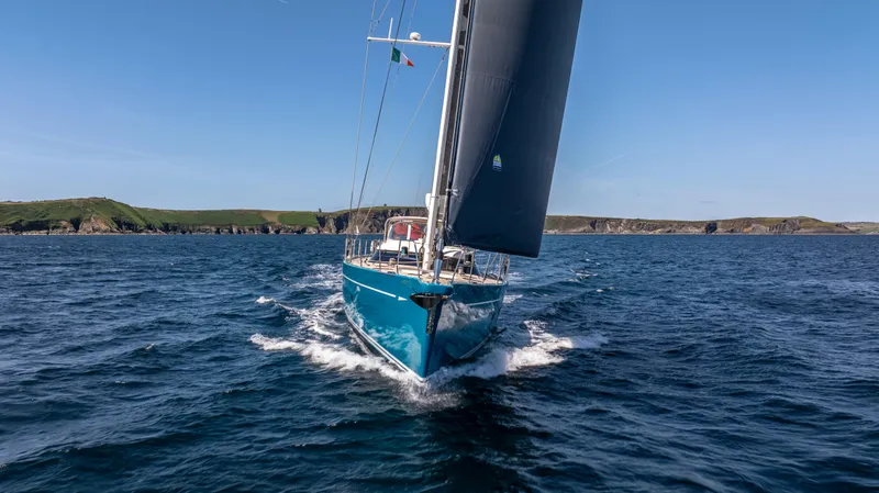 Karibu Yacht Photos Pics Sailing yacht Oyster 885, 2013 model, cruising on open sea under clear blue sky.