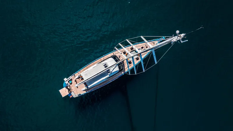 Karibu Yacht Photos Pics Aerial view of 2013 Oyster 885 yacht on deep blue water.