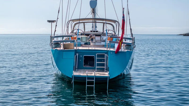 Karibu Yacht Photos Pics Luxury Oyster 885 yacht, 2013 model, anchored in calm waters, rear view.