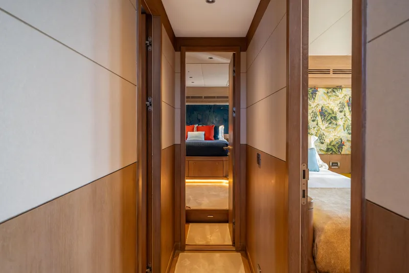 Karibu Yacht Photos Pics Luxurious hallway inside 2013 Oyster 885 yacht, leading to elegant bedrooms.