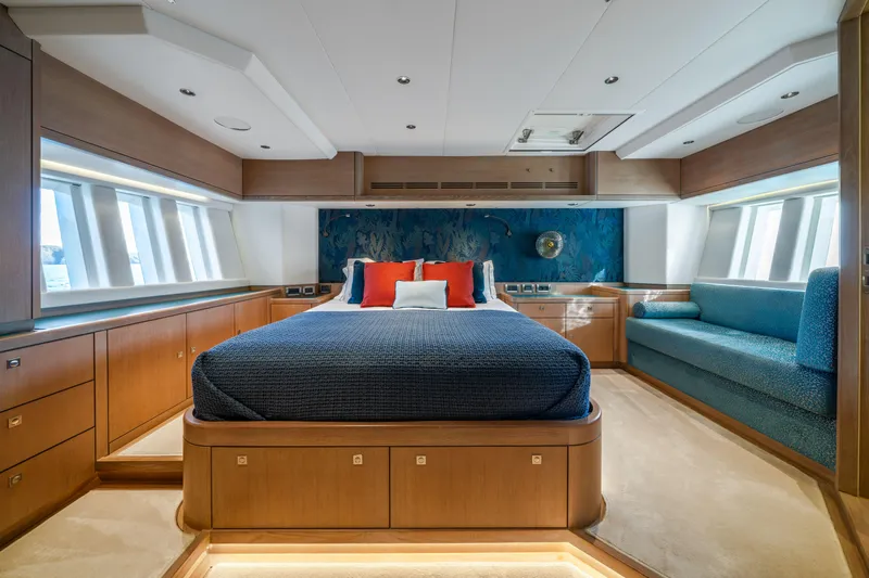 Karibu Yacht Photos Pics Luxurious bedroom interior on 2013 Oyster 885 yacht, featuring elegant wood finishes and modern design.