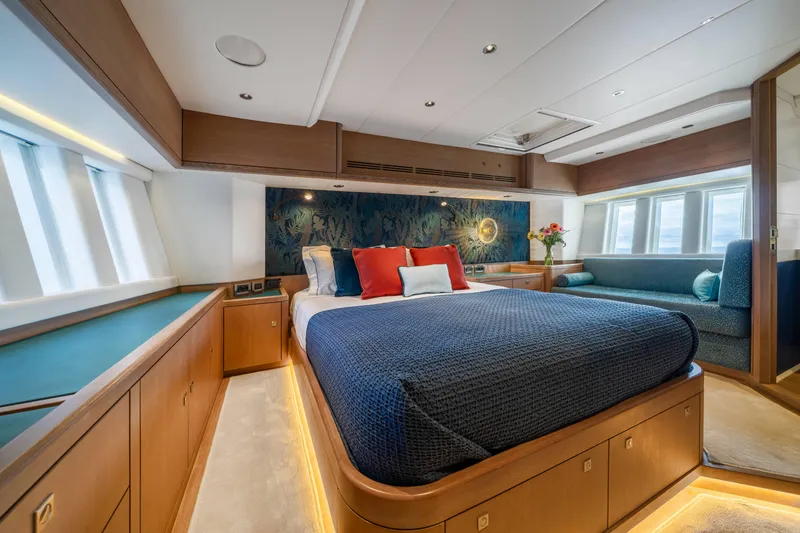 Karibu Yacht Photos Pics Luxurious bedroom interior of 2013 Oyster 885 yacht with elegant decor and natural lighting.