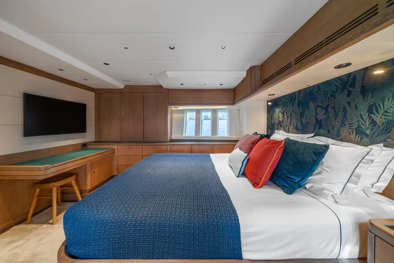 Karibu Yacht Photos Pics Luxurious bedroom interior on 2013 Oyster 885 yacht with modern decor and vibrant cushions.