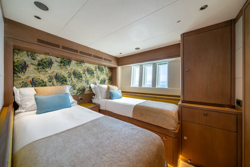 Karibu Yacht Photos Pics Luxurious twin cabin on 2013 Oyster 885 yacht with tropical decor and modern furnishings.