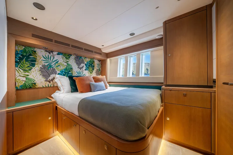 Karibu Yacht Photos Pics Luxurious bedroom interior on 2013 Oyster 885 yacht with modern decor and vibrant accents.