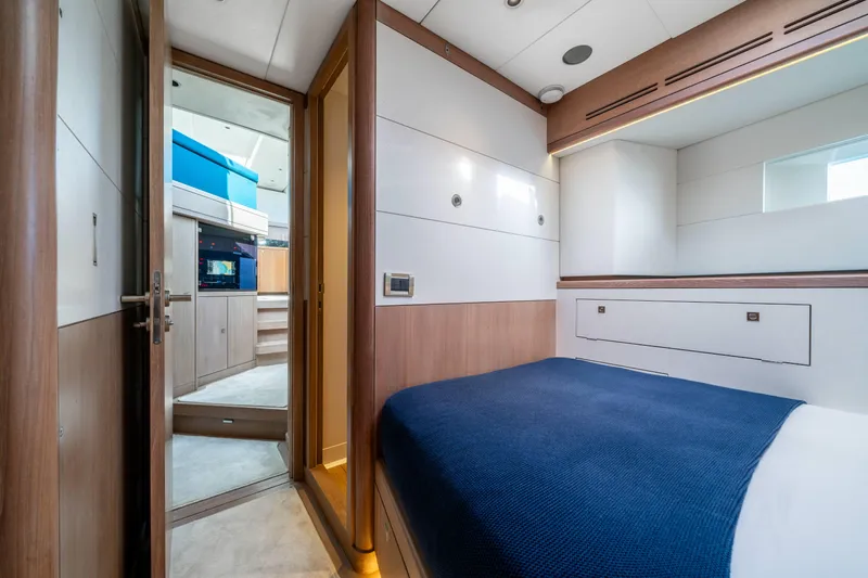 Karibu Yacht Photos Pics Luxurious cabin interior of 2013 Oyster 885 yacht with modern design and blue bedding.