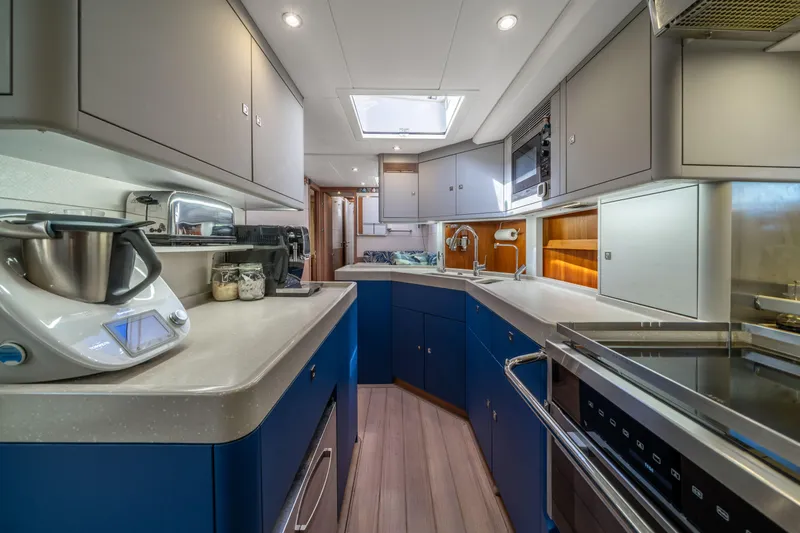 Karibu Yacht Photos Pics Modern kitchen interior of 2013 Oyster 885 yacht with sleek appliances and cabinetry.