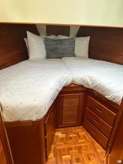 Its About Time Yacht Photos Pics 1996 Grand Banks Classic cabin with cozy twin beds and wooden storage drawers.