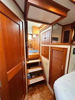 Its About Time Yacht Photos Pics Interior of 1996 Grand Banks Classic yacht with wooden stairs and cabinetry.