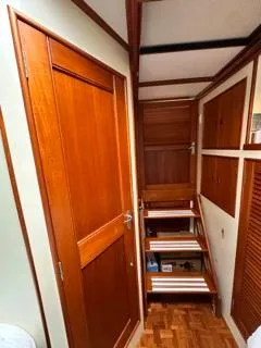 Its About Time Yacht Photos Pics Interior of 1996 Grand Banks Classic yacht with wooden doors and stairs.