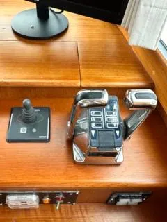 Its About Time Yacht Photos Pics 1996 Grand Banks Classic boat controls with joystick and throttle on wooden dashboard.