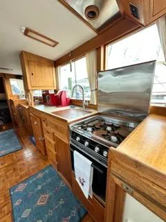 Its About Time Yacht Photos Pics 1996 Grand Banks Classic yacht kitchen with wooden cabinetry and modern appliances.