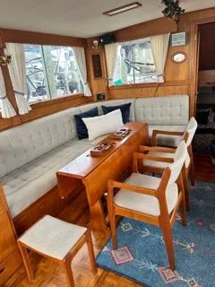 Its About Time Yacht Photos Pics Interior of 1996 Grand Banks Classic yacht with elegant seating and wooden furnishings.
