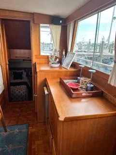 Its About Time Yacht Photos Pics Interior of a 1996 Grand Banks Classic yacht with wooden cabinetry and nautical decor.