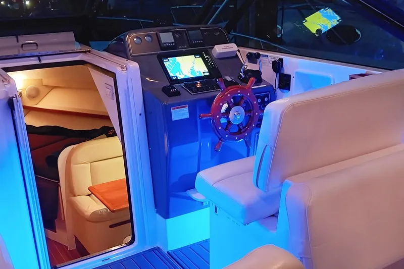  Yacht Photos Pics 2005 Tiara Open Classic boat interior with illuminated cockpit and cozy cabin.