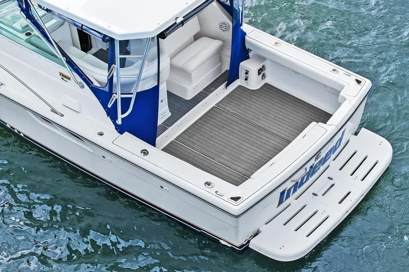  Yacht Photos Pics 2005 Tiara Open Classic boat on water, featuring spacious deck and seating area.