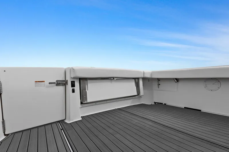  Yacht Photos Pics 2005 Tiara Open Classic boat deck with open hatch under clear blue sky.