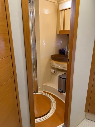 Luna Yacht Photos Pics Bathroom interior of 2014 Azimut Atlantis 45 yacht, featuring modern wood finishes.