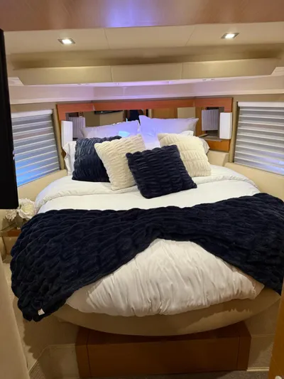 Luna Yacht Photos Pics Luxurious bedroom interior of 2014 Azimut Atlantis 45 yacht with plush bedding and pillows.