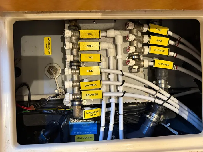 Luna Yacht Photos Pics Plumbing system of 2014 Azimut Atlantis 45 yacht, labeled pipes for sink, shower, and WC.