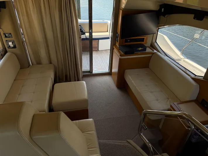 Luna Yacht Photos Pics Luxurious interior of 2014 Azimut Atlantis 45 yacht with seating and TV.