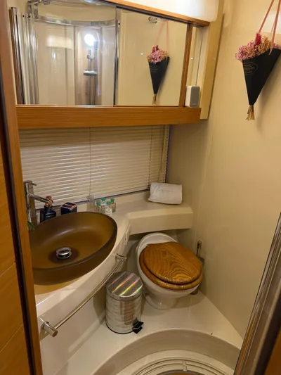 Luna Yacht Photos Pics Luxurious bathroom in 2014 Azimut Atlantis 45 yacht with modern fixtures and elegant decor.