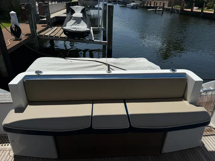 Luna Yacht Photos Pics Azimut Atlantis 45 yacht's rear seating area by the dock, 2014 model.