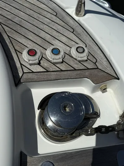 Luna Yacht Photos Pics Azimut Atlantis 45 yacht deck controls and winch, 2014 model, featuring wood paneling.