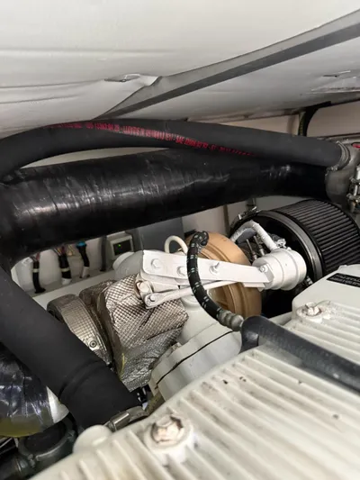 Luna Yacht Photos Pics Engine compartment of a 2014 Azimut Atlantis 45 yacht, featuring hoses and mechanical components.