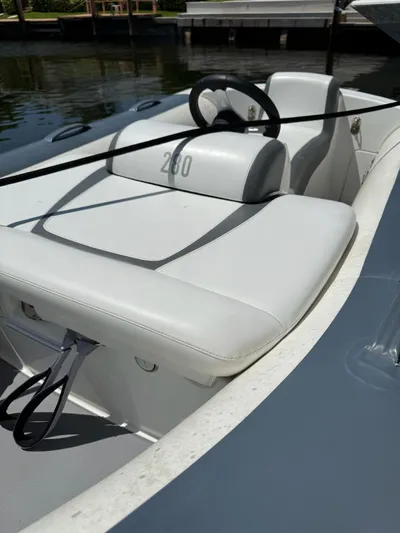 Luna Yacht Photos Pics Azimut Atlantis 45 boat interior, 2014 model, featuring sleek white seating and steering wheel.