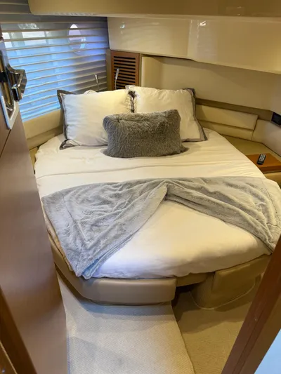 Luna Yacht Photos Pics Cozy bedroom interior of 2014 Azimut Atlantis 45 yacht with plush bedding.