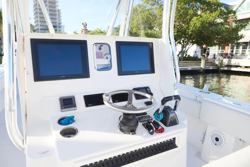  Yacht Photos Pics 2014 Contender 39 ST boat helm with dual screens and steering wheel.