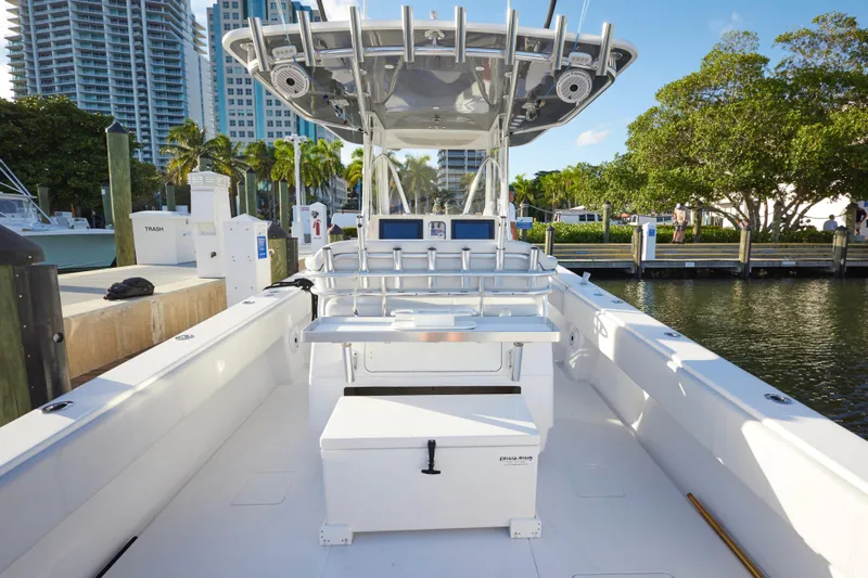  Yacht Photos Pics 2014 Contender 39 ST boat docked, featuring spacious deck and modern amenities.